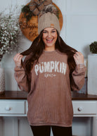 Happiness Trails Boutique - Pumpkin Spice screen printed on a taupe corded sweatshirt