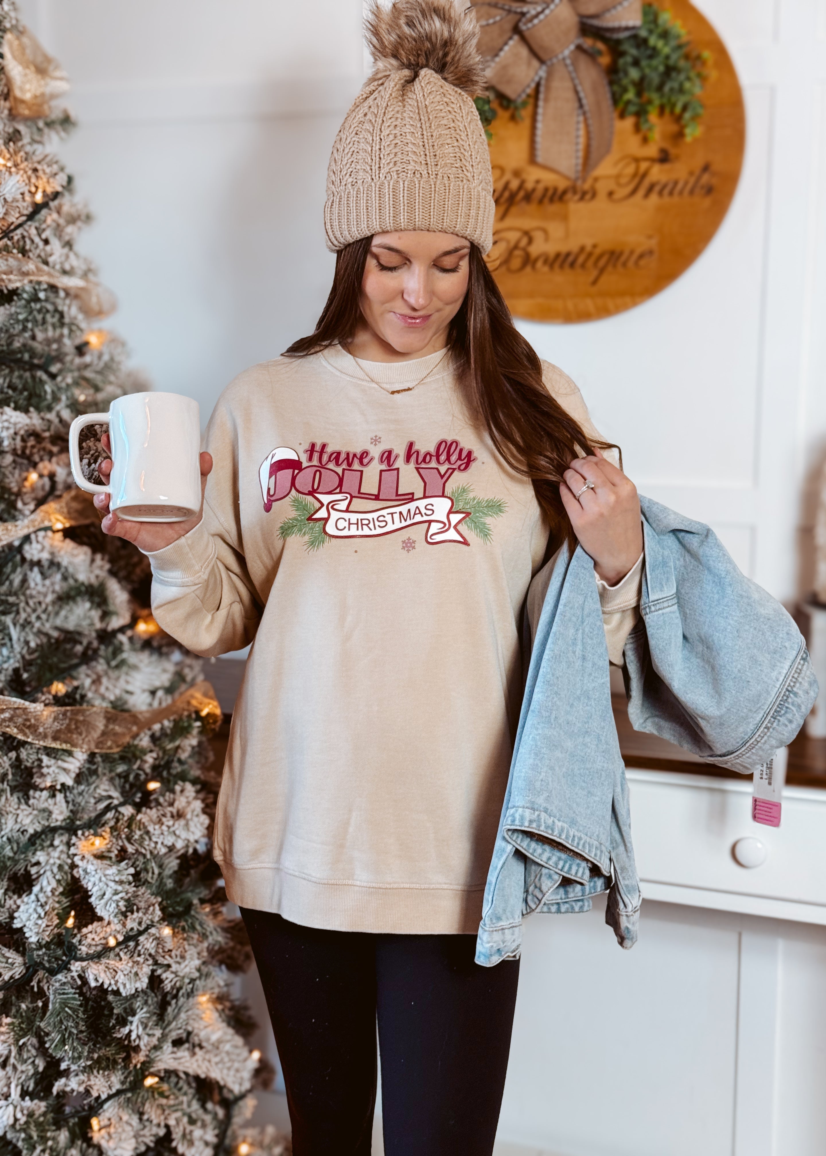 Happiness Trails Boutique - Have A Holly Jolly Christmas screen printed on an oatmeal sweatshirt