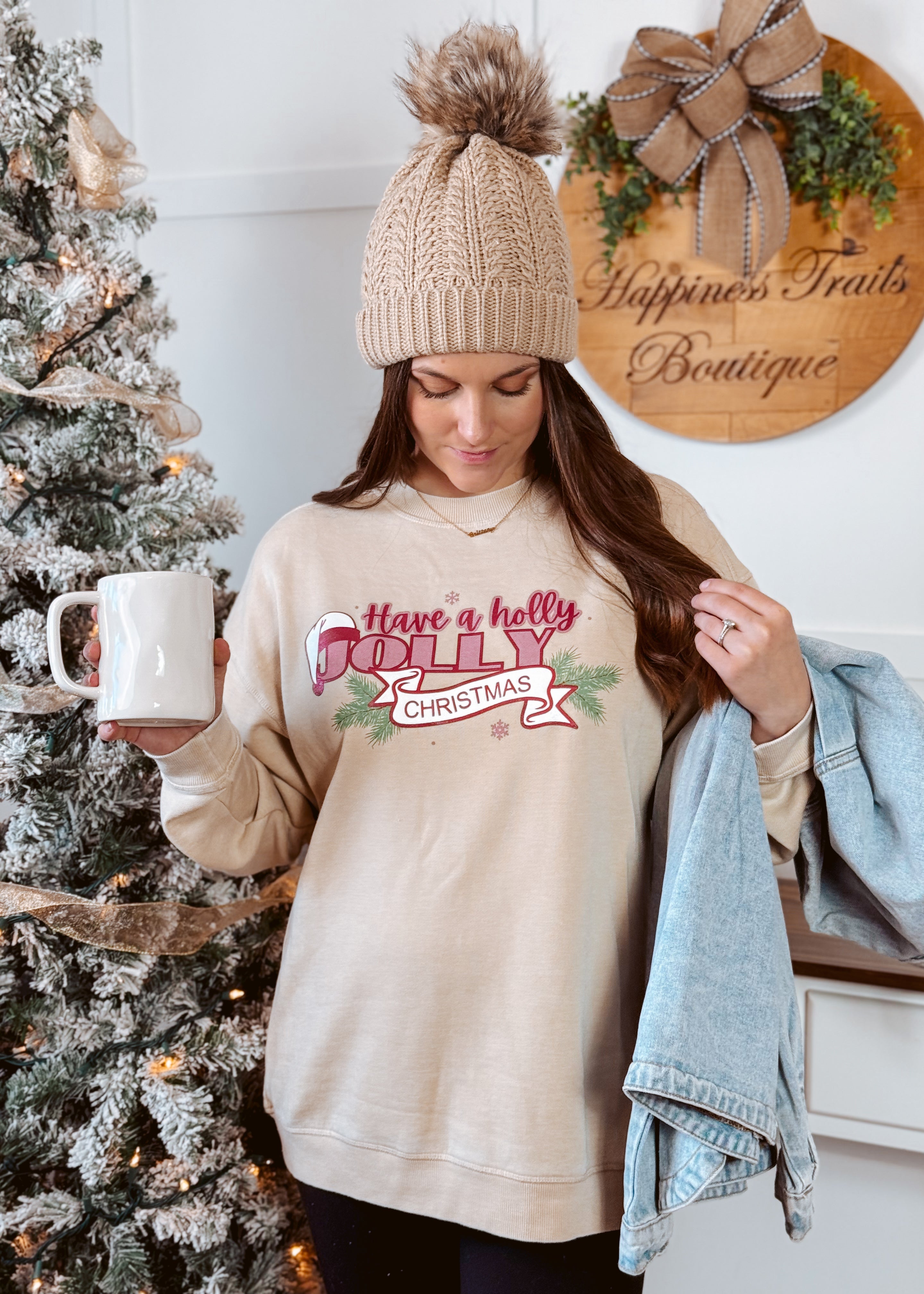 Happiness Trails Boutique - Have A Holly Jolly Christmas screen printed on an oatmeal sweatshirt